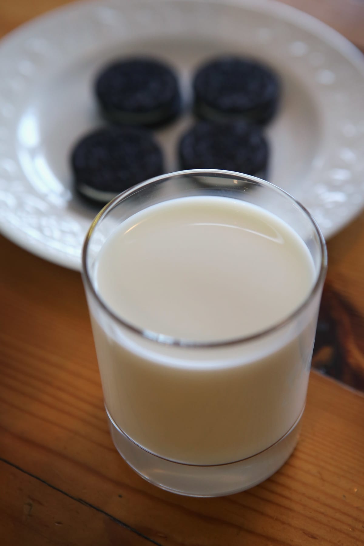 Glass of milk on a wooden table
