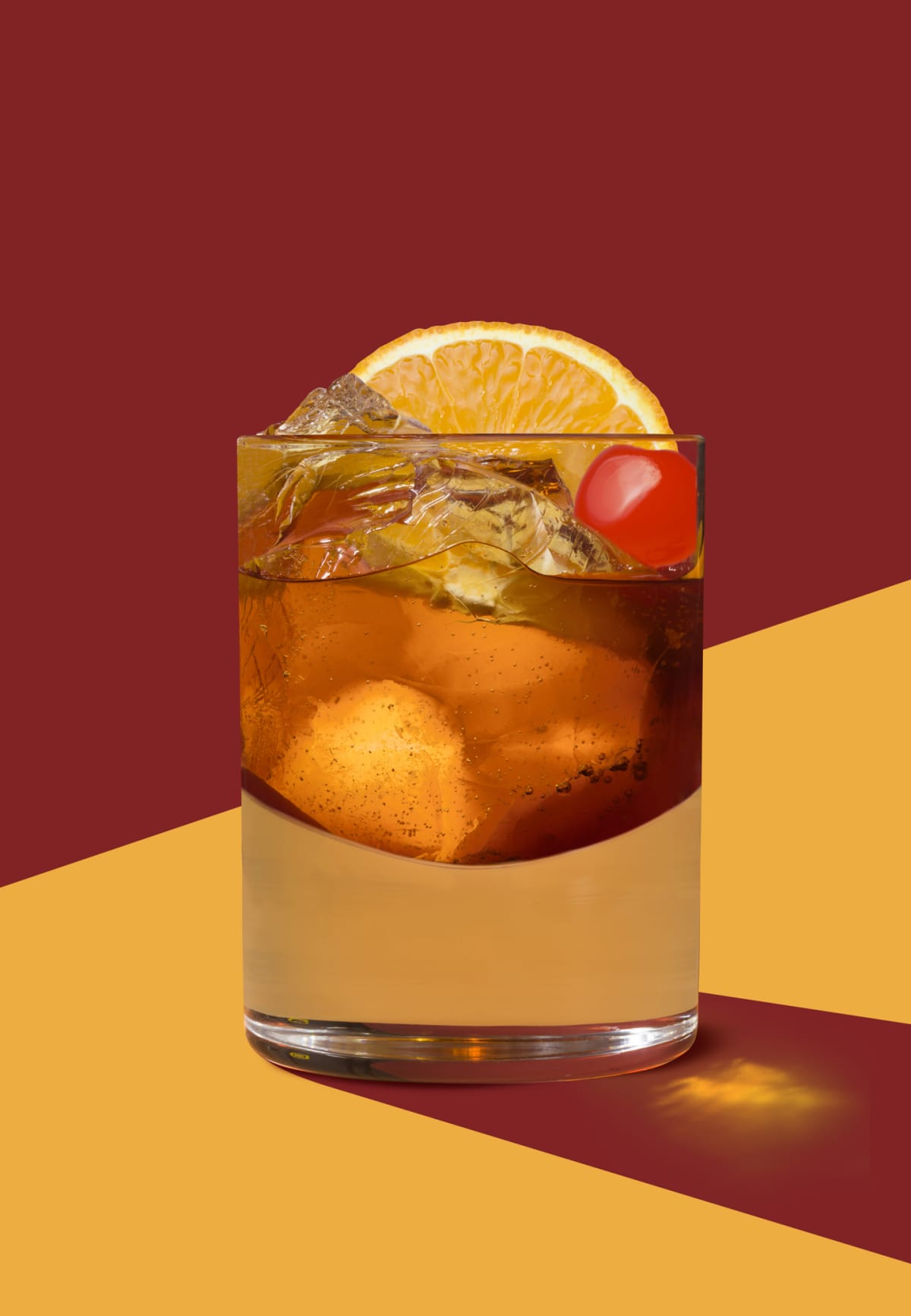 Old Fashioned whisky cocktail shot in flat art deco style on graphic red and orange background