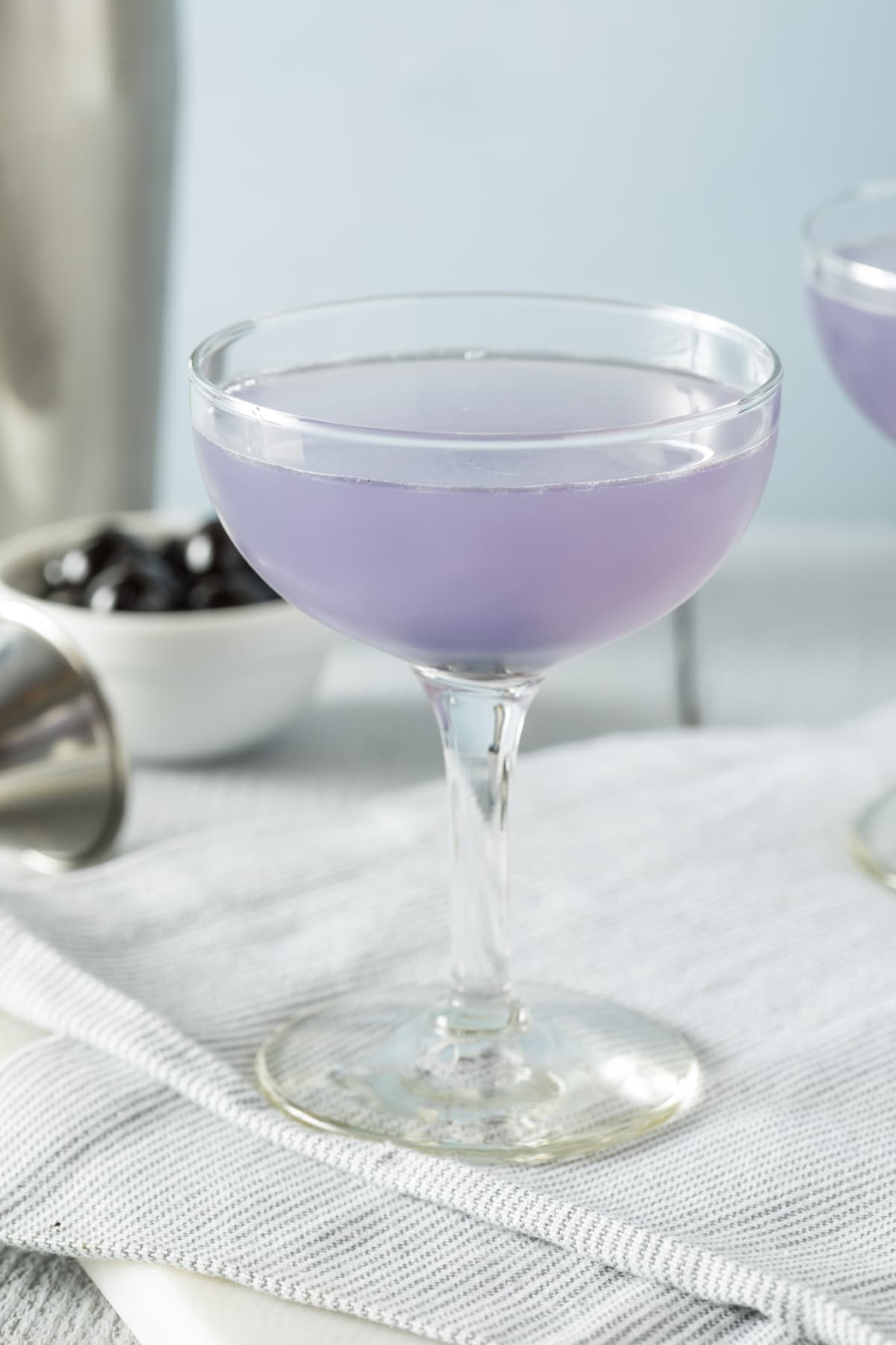 Sweet Violet Aviation Cocktail with a Cherry Garnish