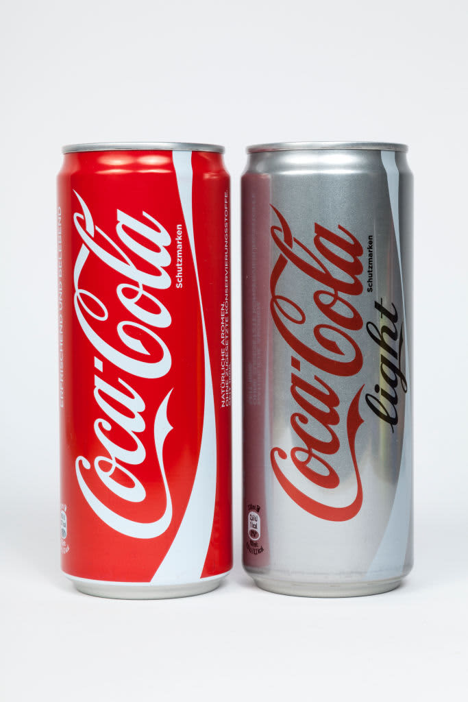 Two cans of Coca-Cola