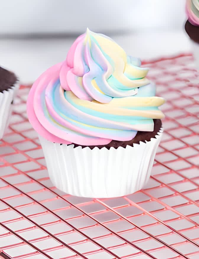 Cupcake with swirled rainbow icing