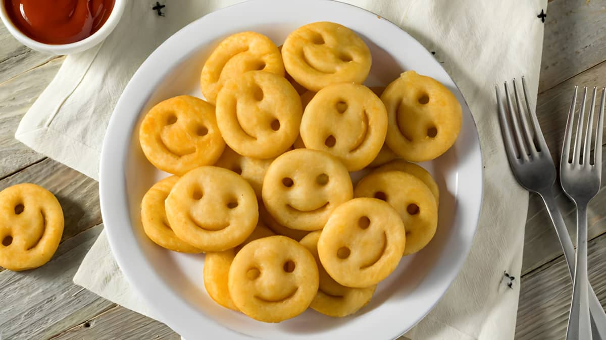 Pile of smiley fries on a white plate
