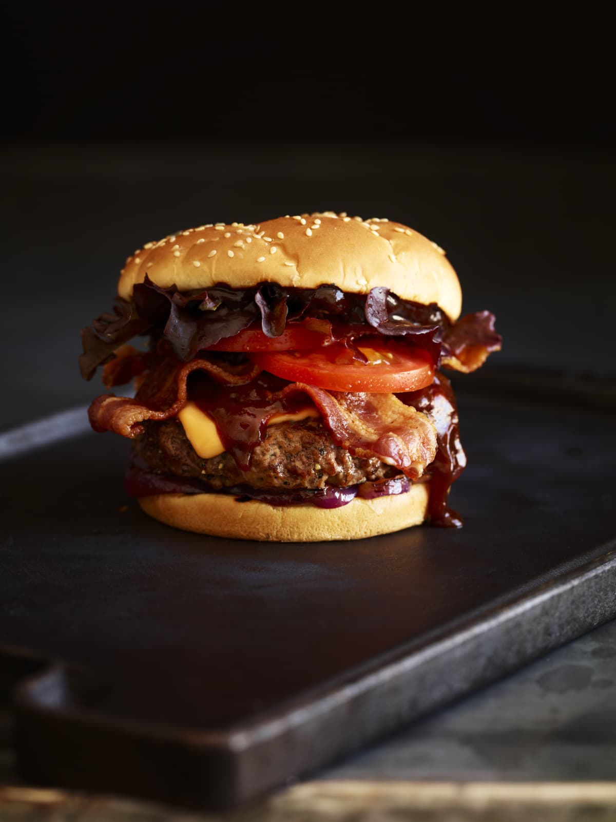 Bacon BBQ Burger on a cutting board.