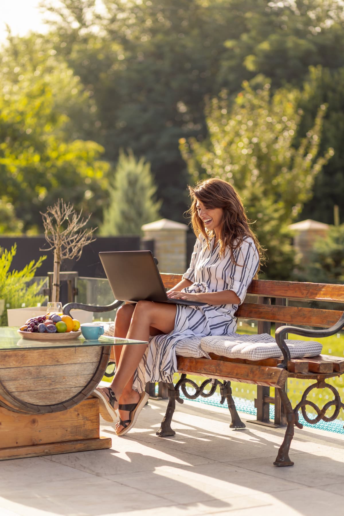 woman using a laptop outside 