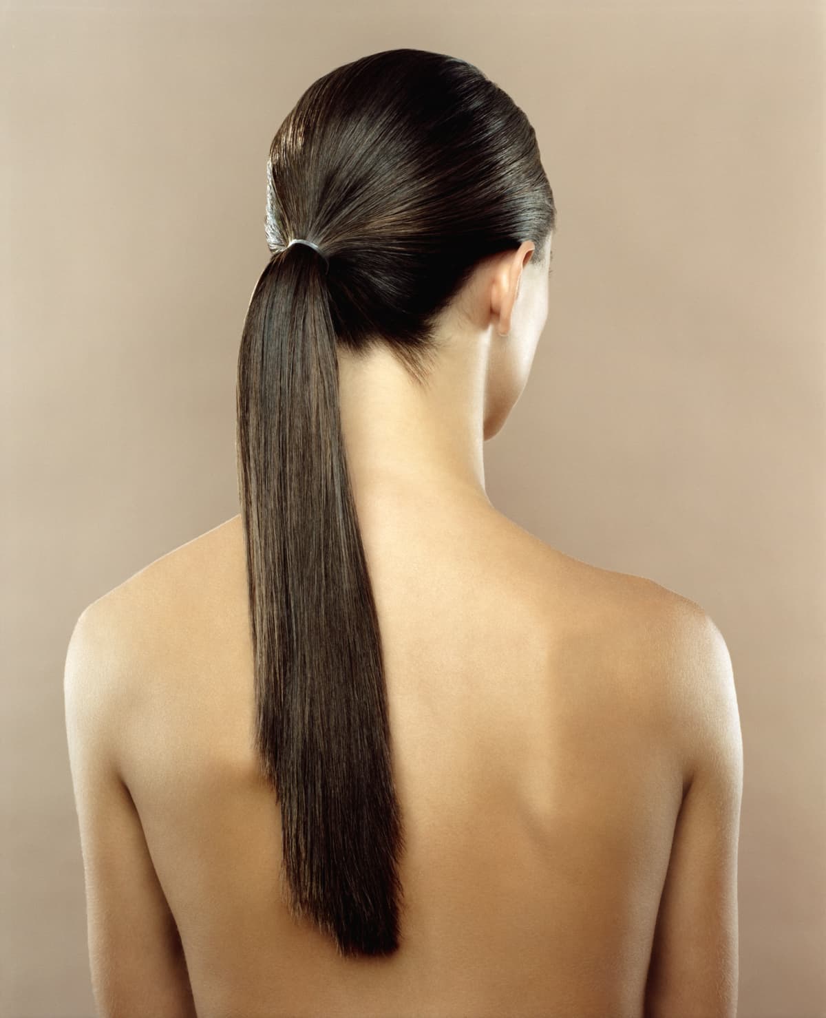 a woman wearing a ponytail