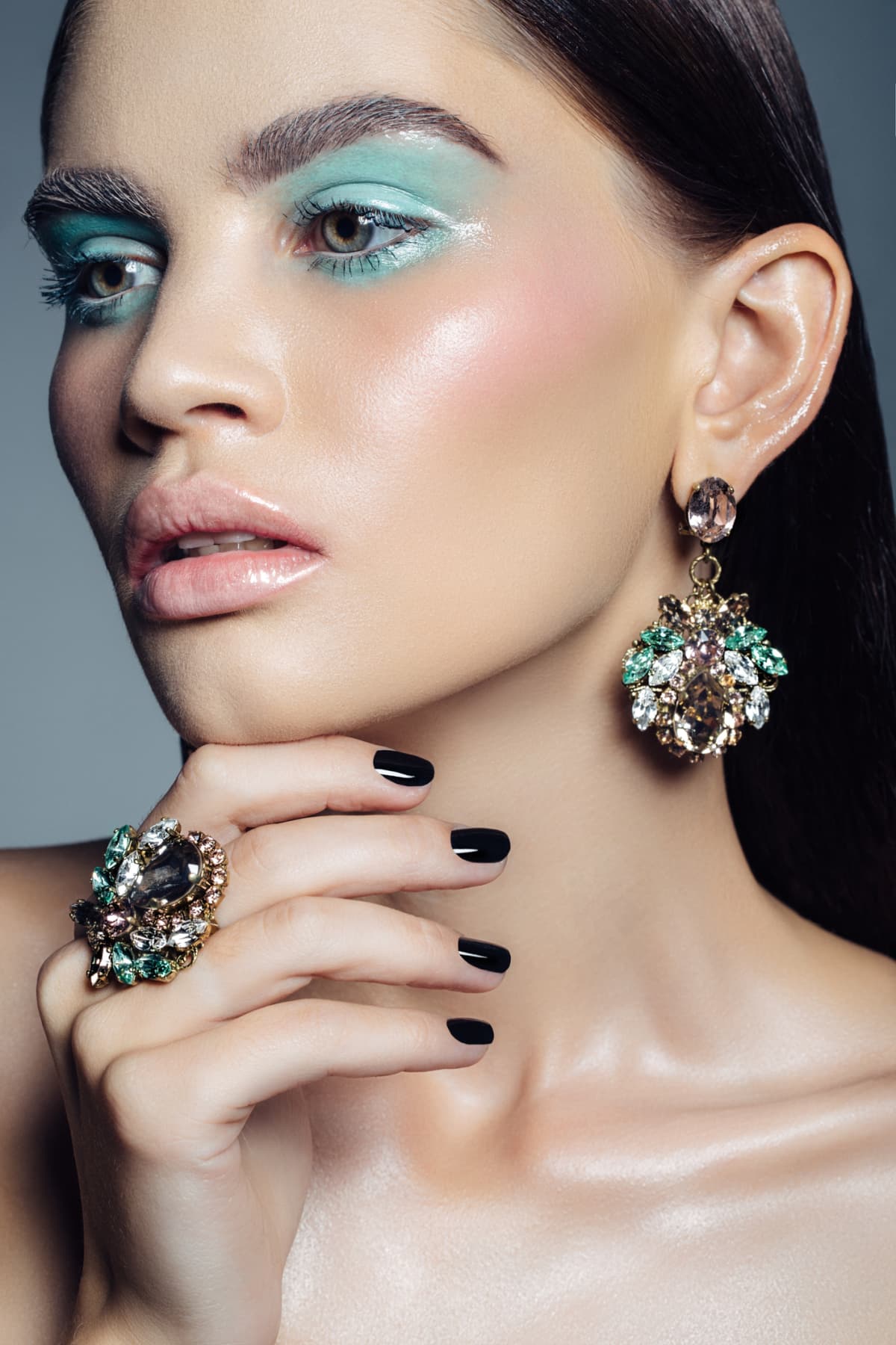 Elegant girl advertising jewelry. Professional make-up.