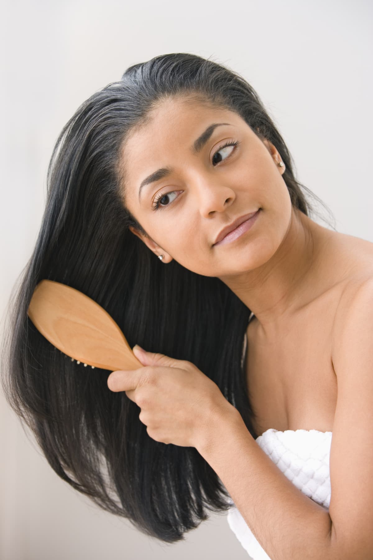 a woman brushing her hair