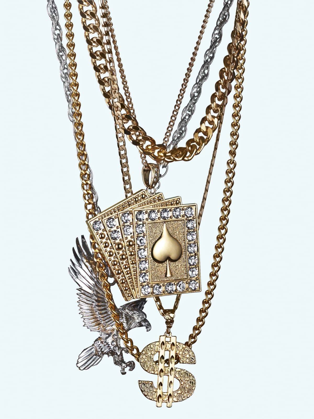 jewellery made from american symbols such as the american eagle, the dollar symbol and a deck of cards