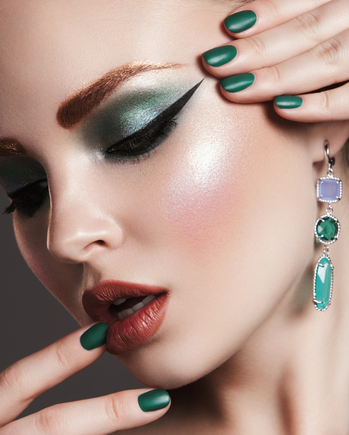 Woman with bright make-up and manicure