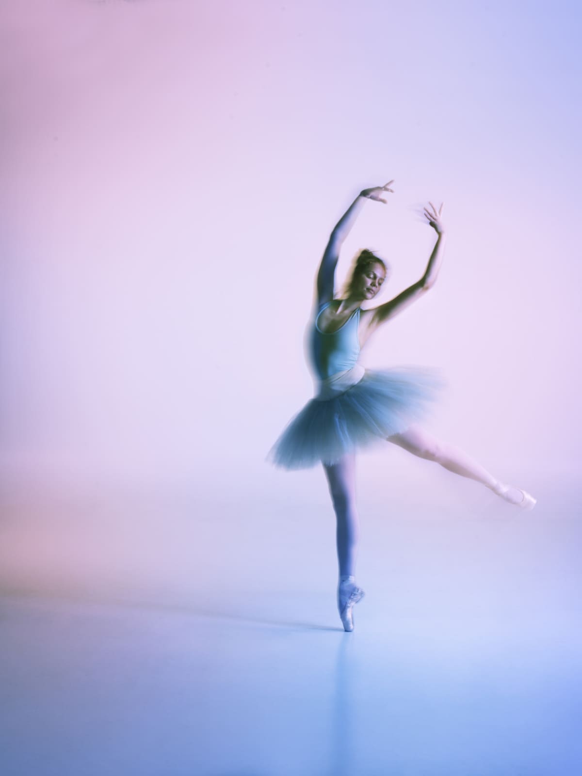 Ballet dancer long exposure doing pirouette