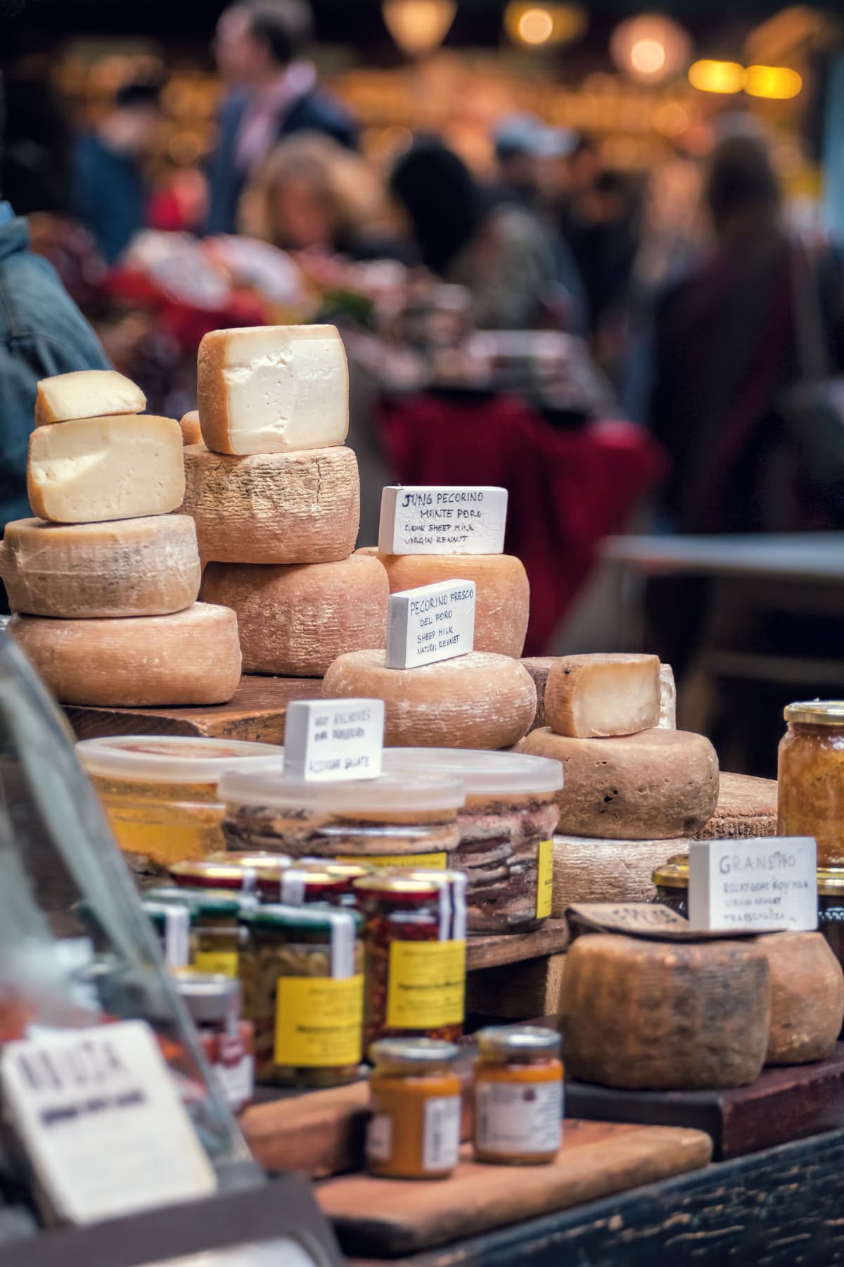 Assortment of cheeses in market in France.