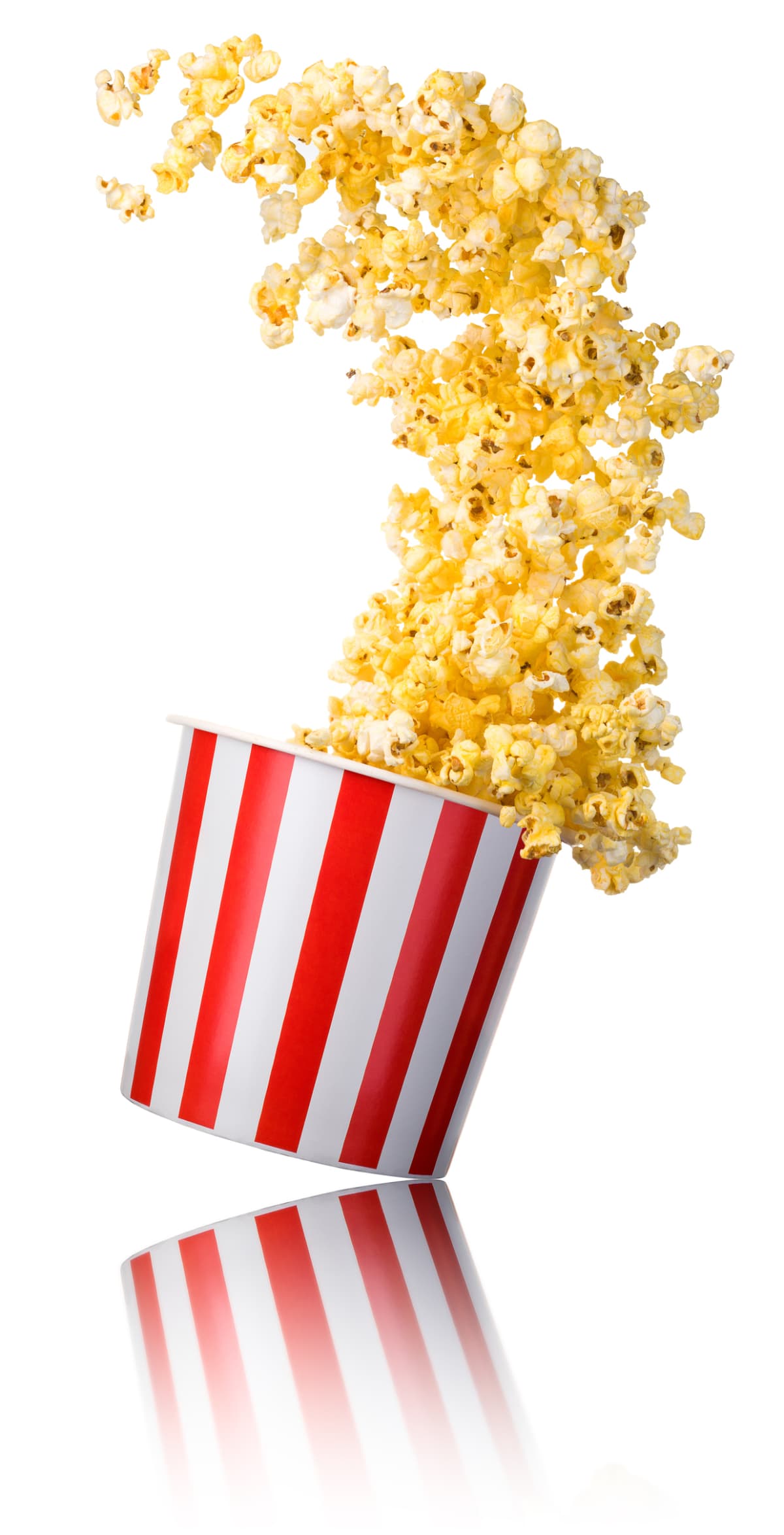 Overhead image of white popcorn box with popcorn spilling out photographed on white background with  cast shadow.