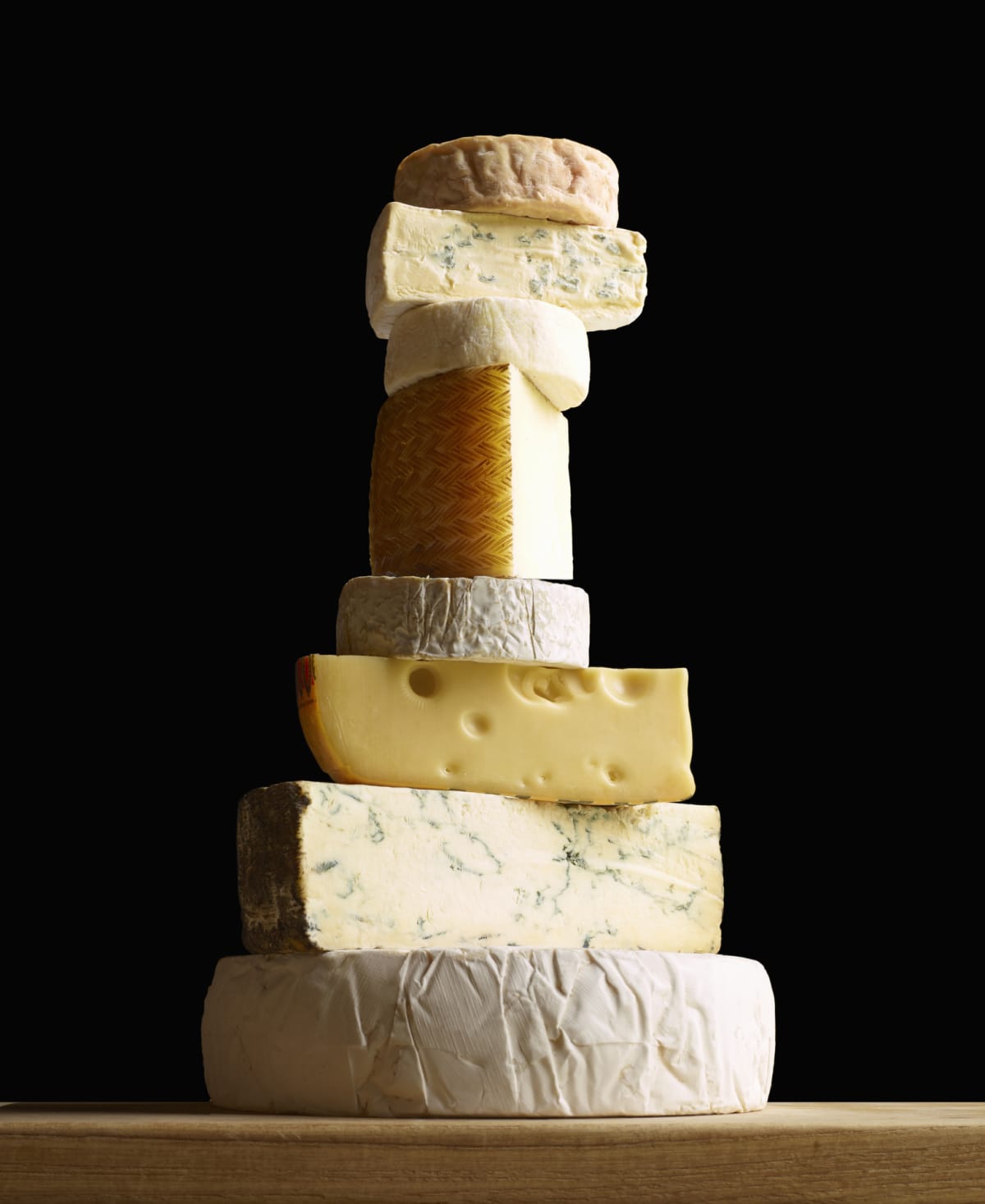 Cheeses stacked into a tower