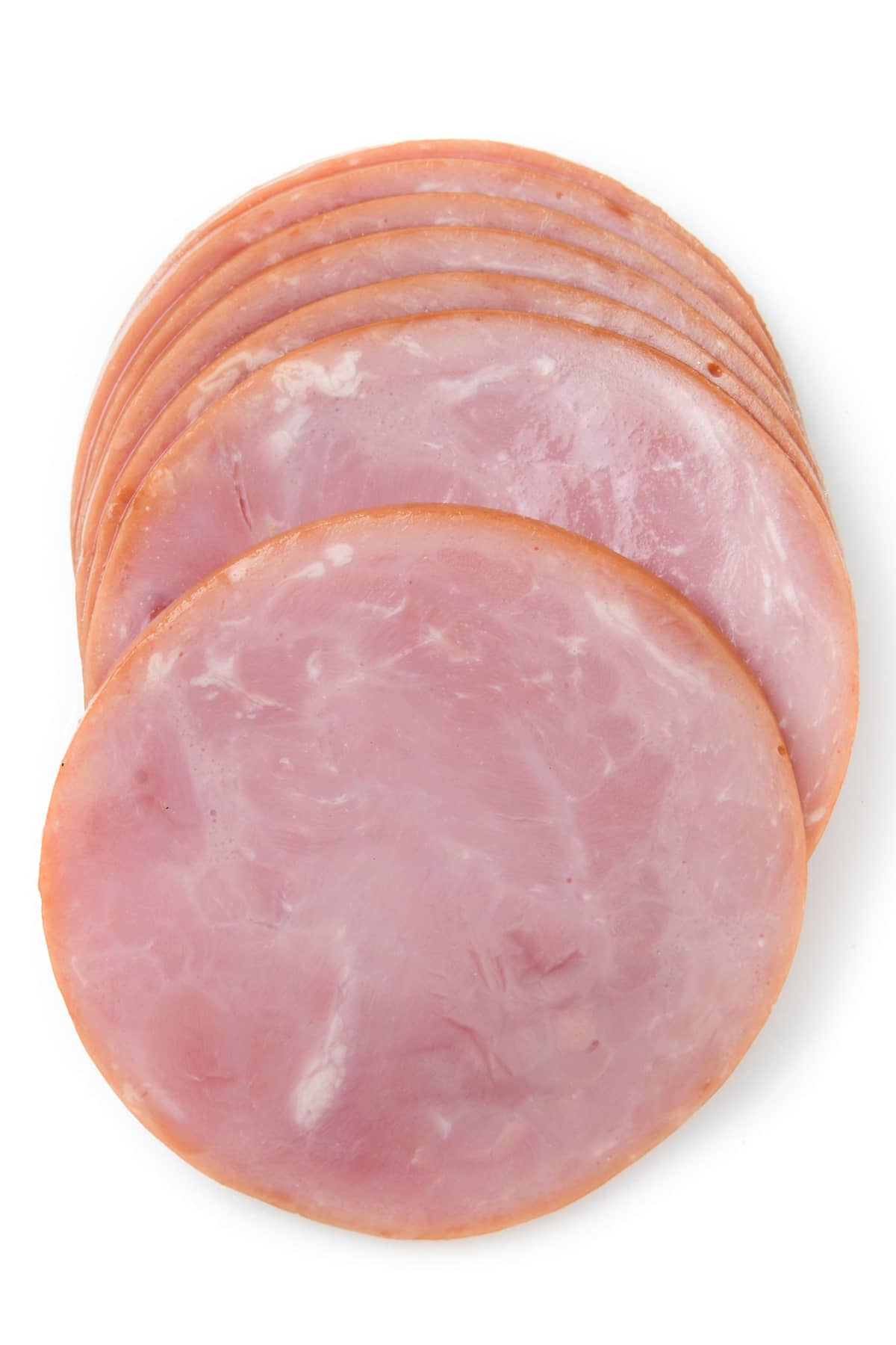 Sliced Canadian Bacon on white background from above