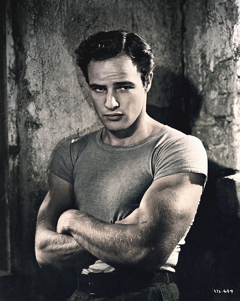 Marlon Brando, in character as Stanley Kowalski from Tennessee Williams' A Streetcar Named Desire. Brando portrayed Kowalski in the 1952 film of the play directed by Elia Kazan.