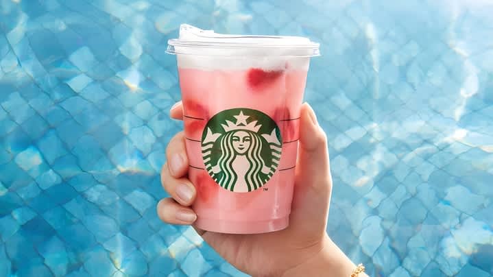 pink drink from starbucks on a blue background