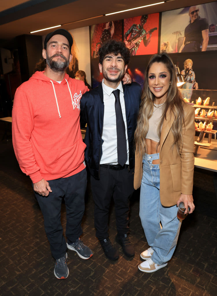 INGLEWOOD, CALIFORNIA - JUNE 01: (L-R) CM Punk, President of All Elite Wrestling Tony Khan and Britt Baker, D.M.D. attend TBS's AEW Dynamite Los Angeles Debut After Party at The Forum on June 01, 2022 in Inglewood, California. (Photo by Leon Bennett/Getty Images for Warner Bros. Discovery)