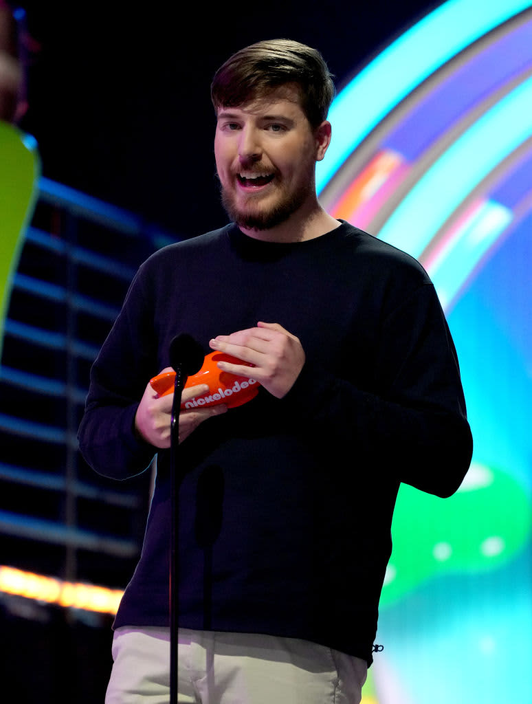 SANTA MONICA, CALIFORNIA - APRIL 09: MrBeast accepts the  Favorite Male Creator award onstage during the Nickelodeon's Kids' Choice Awards 2022 at Barker Hangar on April 09, 2022 in Santa Monica, California. (Photo by Kevin Mazur/Getty Images for Nickelodeon)Favorite Male Creator