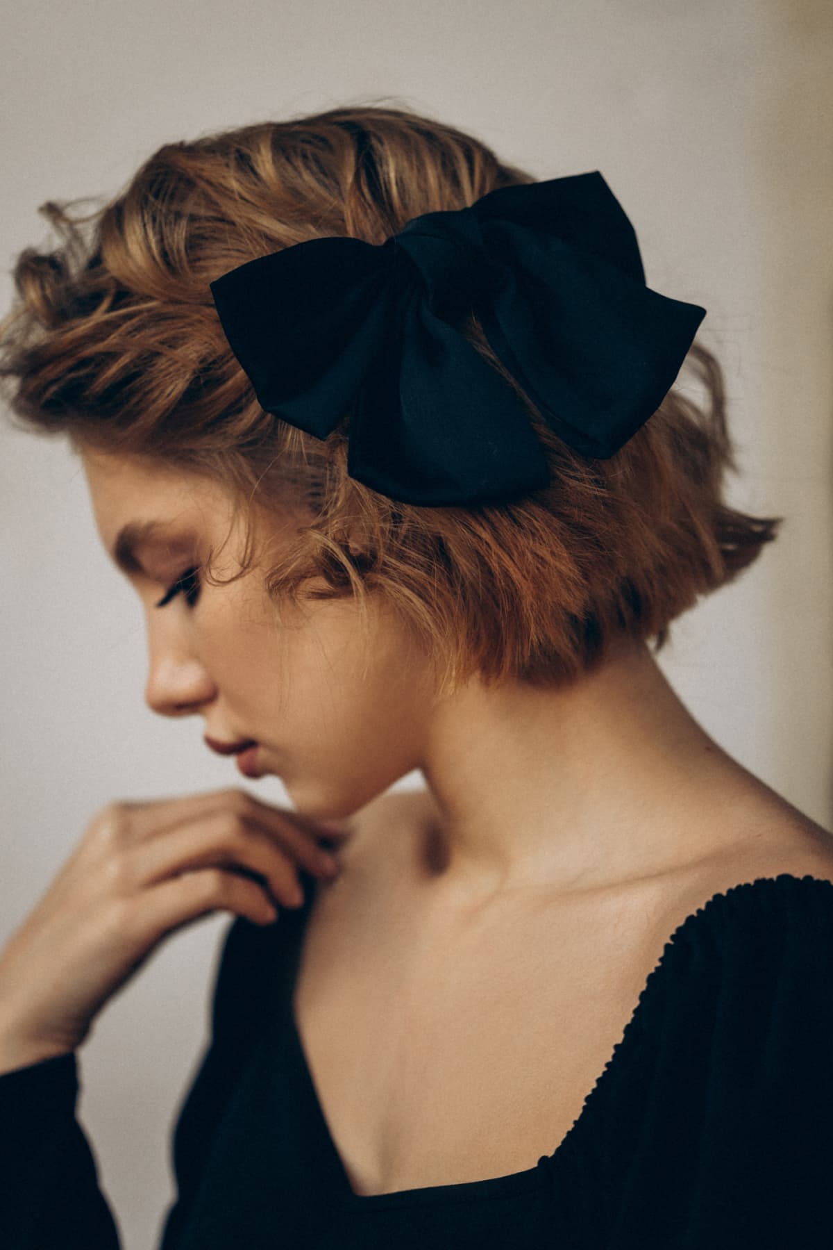 Woman wearing a bow in her hair. 