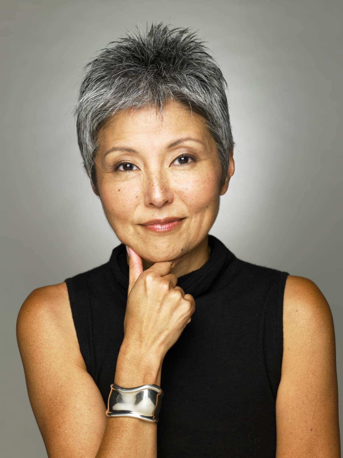 Woman with short, gray, pixie haircut