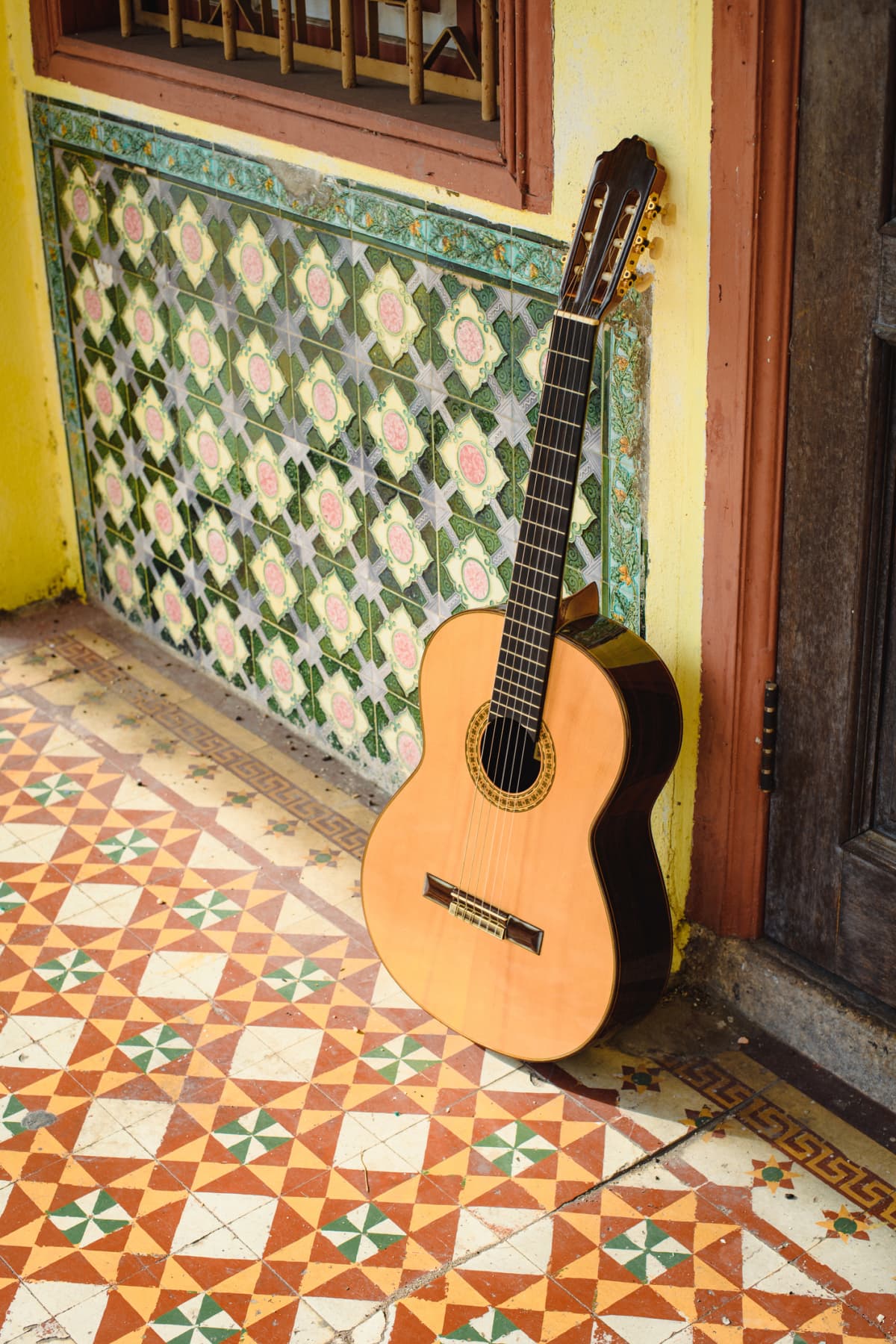 Spanish tiles on floor and wall with guitar