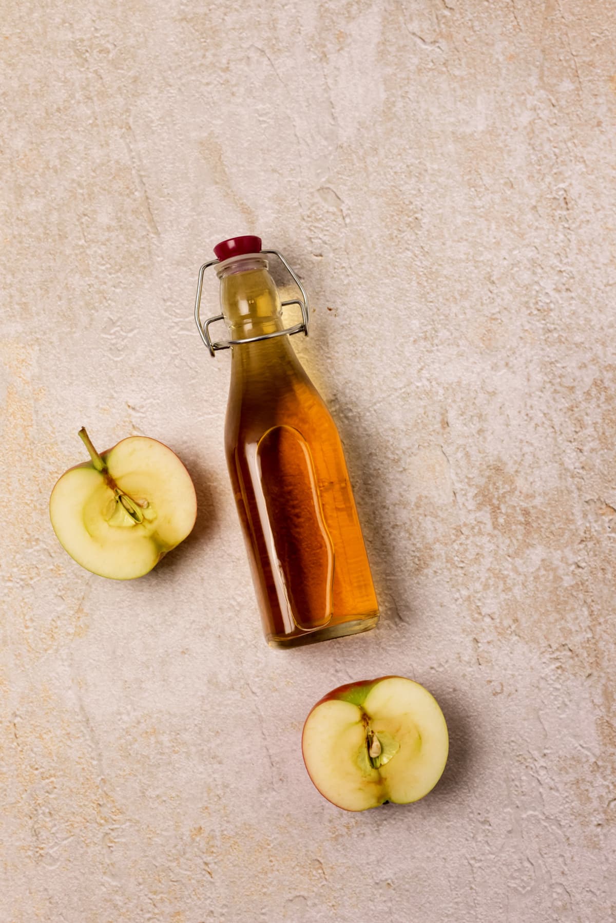 Apple Cider Vinegar Bottle on Concrete Background