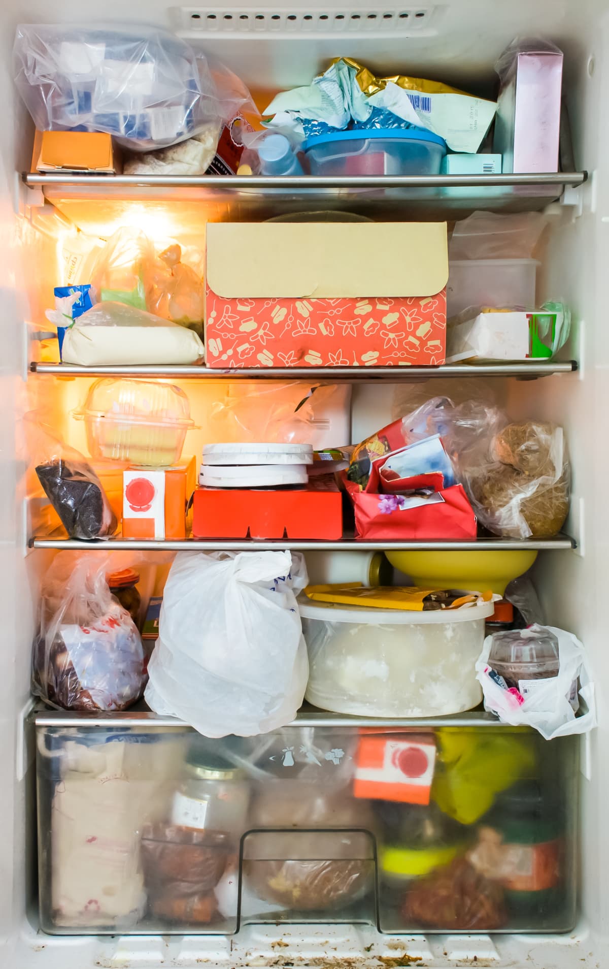vegetables and jars inside the refrigerator