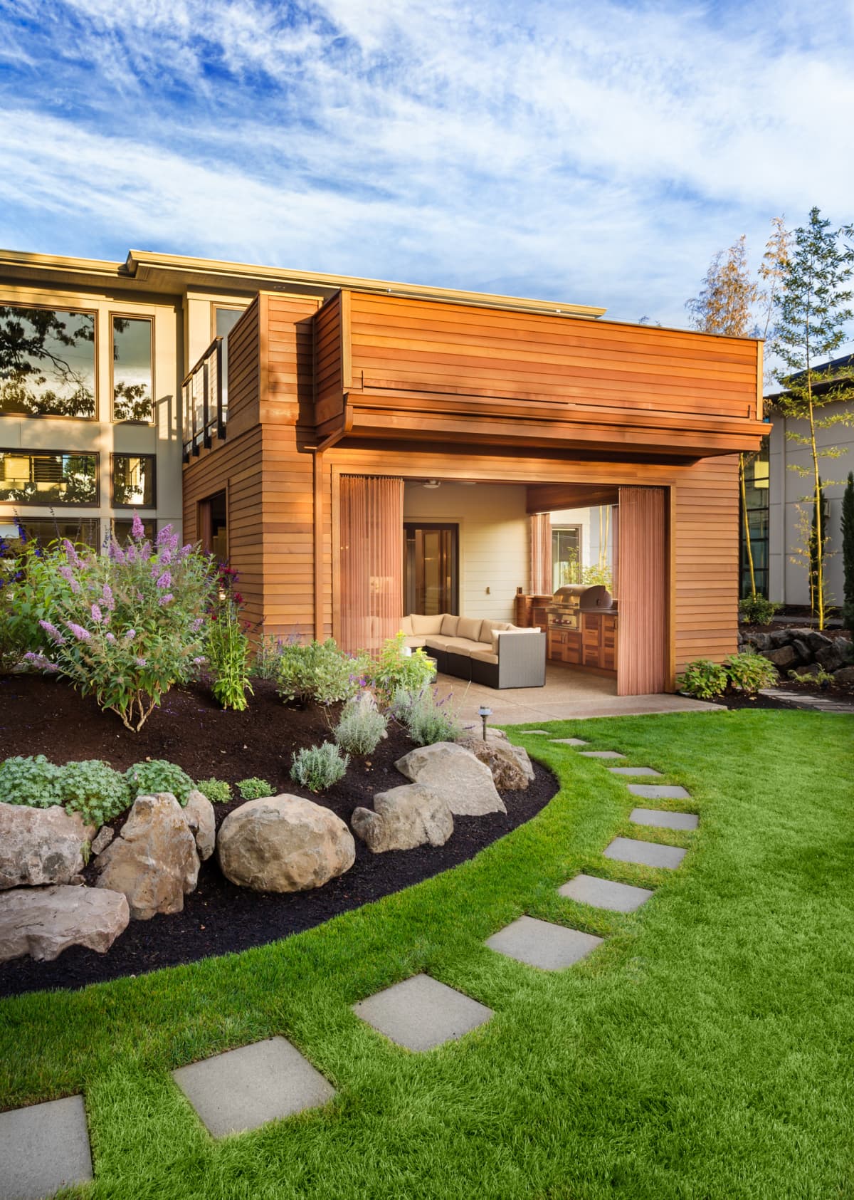 Beautiful modern home exterior with garden