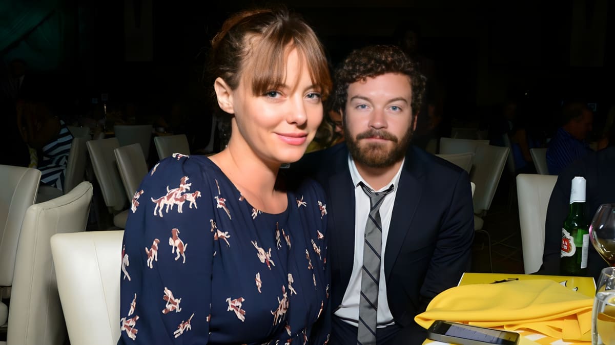 Bijou Phillips smiling and posing with Danny Masterson.