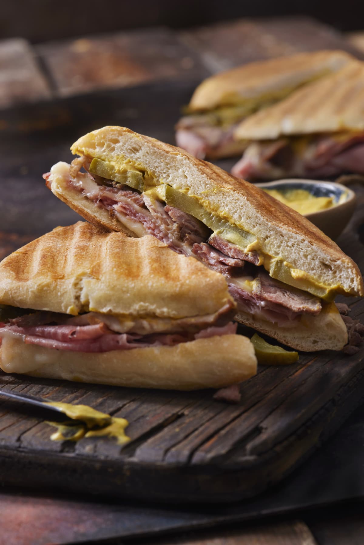 Classic Grilled Cuban Sandwich with Roast Pork, Honey Ham, Swiss Cheese, Dill Pickles and Mustard