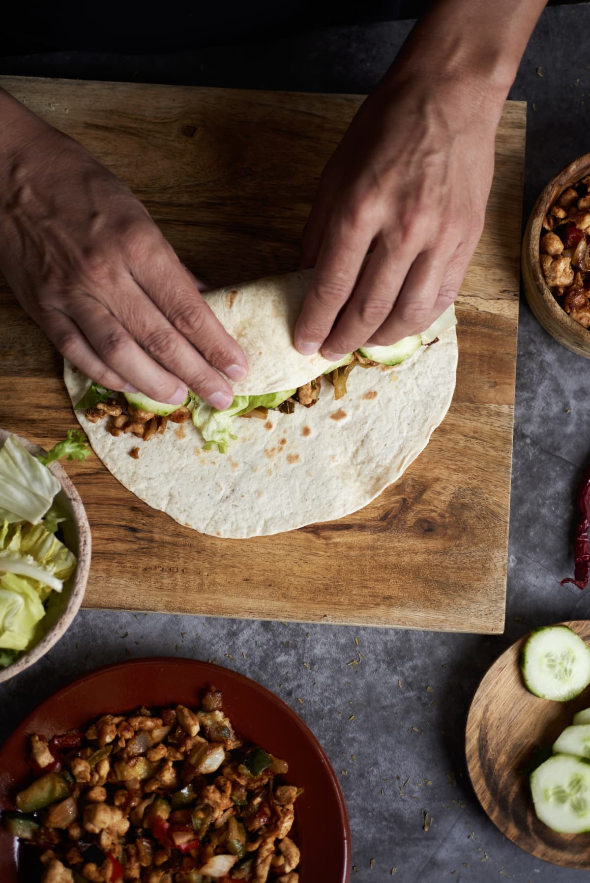 A burrito on a cutting board