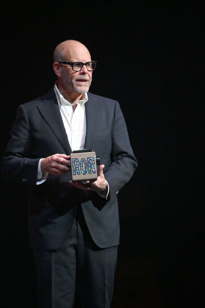 Alton Brown speaking at an event.