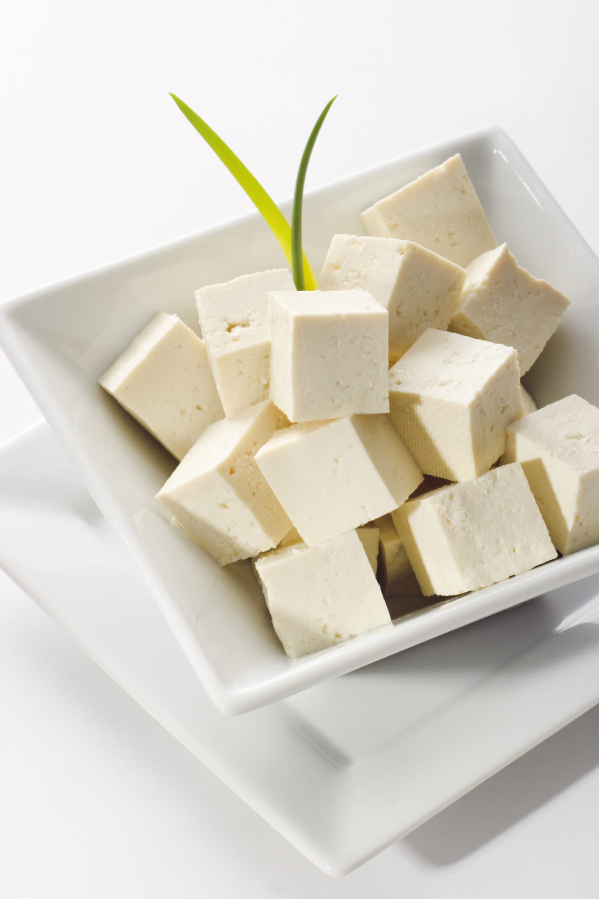 Cubed tofu in a white bowl
