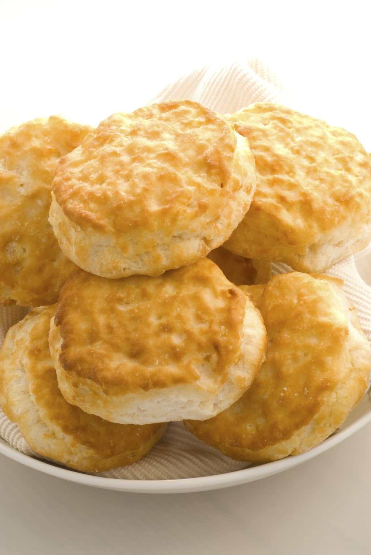 Cooked biscuits piled on a plate