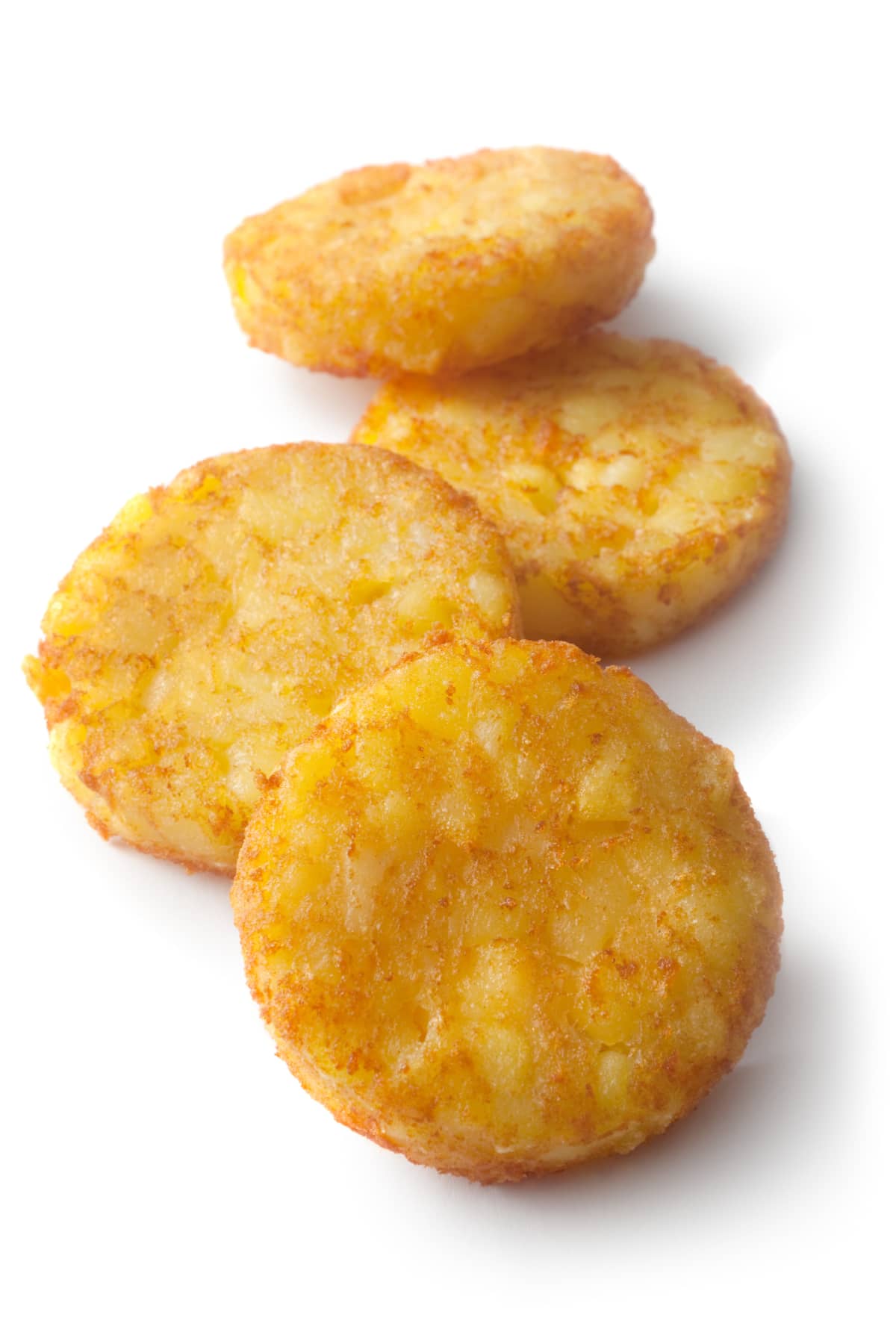 hash browns on a white surface