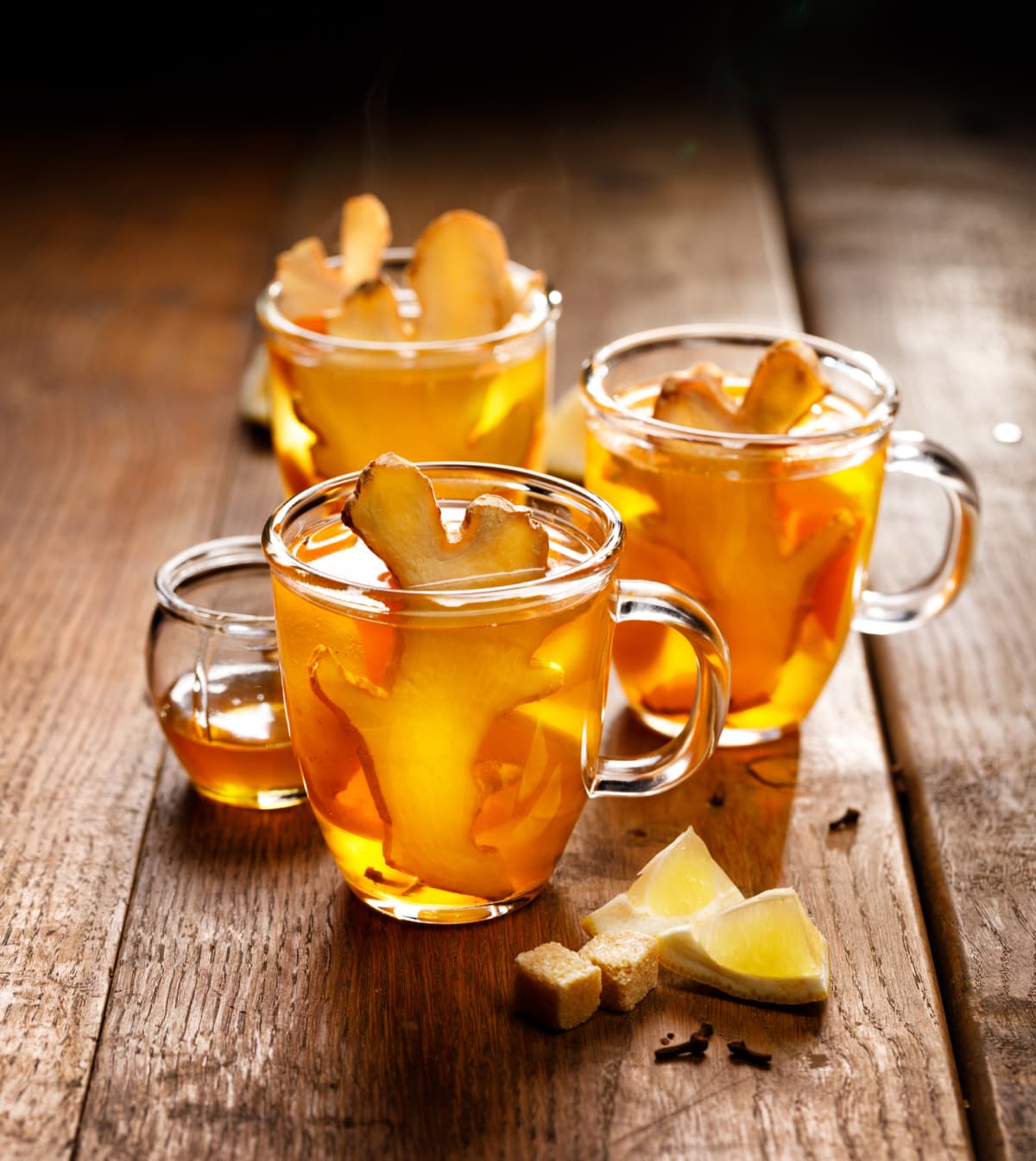 Tea with lemon and ginger on a wooden background rustic style, close up