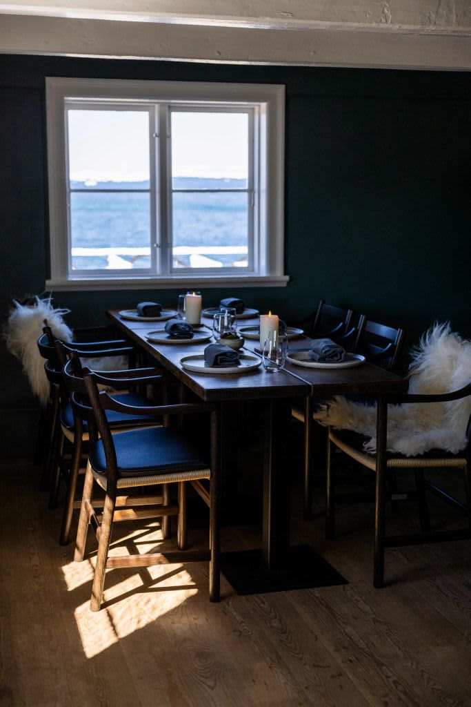 The dining area is pictured in the KOKS restaurant of double-Michelin-starred Faroese chef Poul Andrias Ziska housed in the Poul Egedes House in Ilimanaq, Greenland, on June 28, 2022. - Restaurant Koks, usually housed in the Faroe Islands, where they have been awarded two Michelin stars, moved to Ilimanaq Lodge and is open between June 12 and September 8, 2022 and 2023, serving a tasting menu in the small settlement 300km north of the polar circle, home to 53 permanent residents. - TO GO WITH AFP STORY by Camille BAS-WOHLERT (Photo by Odd ANDERSEN / AFP) / TO GO WITH AFP STORY by Camille BAS-WOHLERT (Photo by ODD ANDERSEN/AFP via Getty Images)