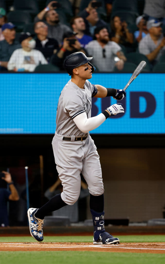 ARLINGTON, TX - OCTOBER 4: 
Aaron Judge #99 of the New York Yankees rounds the bases after hitting his 62nd home run of the season against the Texas Rangers during the first inning in game two of a double header at Globe Life Field on October 4, 2022 in Arlington, Texas. Judge has now set the American League record for home runs in a single season. (Photo by Ron Jenkins/Getty Images)
