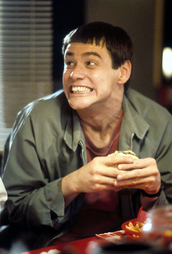 Jim Carrey having burger in a scene from the film 'Dumb & Dumber', 1994. (Photo by New Line Cinema/Getty Images)