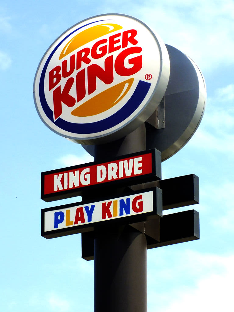 Loanhead, Scotland - 25 May 2021 Burger King and KFC fast food restaurants drive thru signs on a roadside near Edinburgh