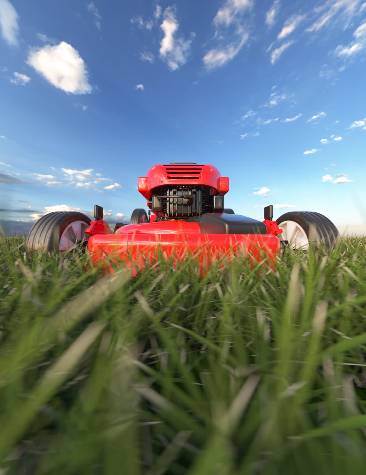 Close up detail of a modern red petrol lawnmower on a bright sunny summers day 3d render