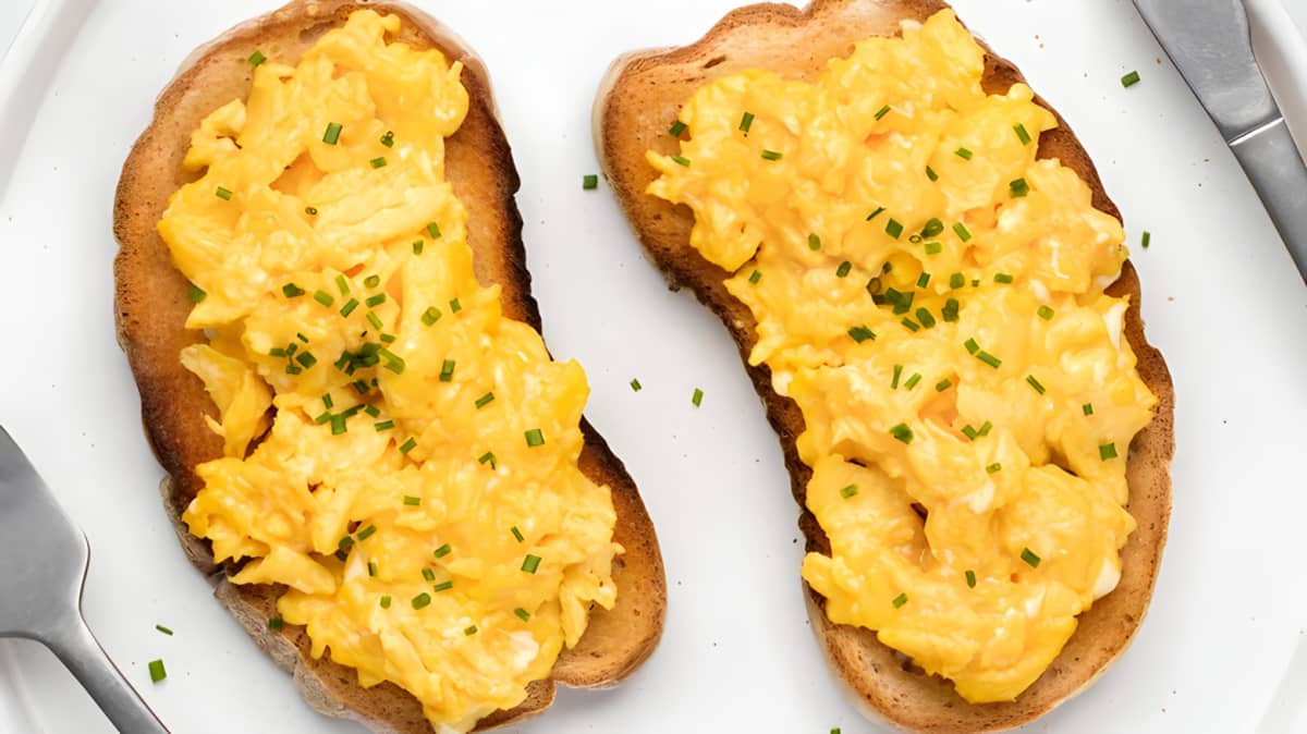 Fluffy scrambled eggs on toast.