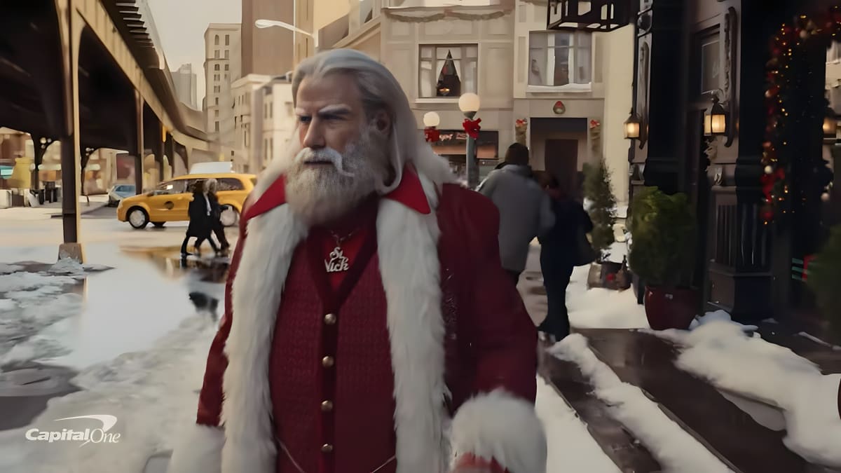 John Travolta dressed as Santa for a Capital One commercial