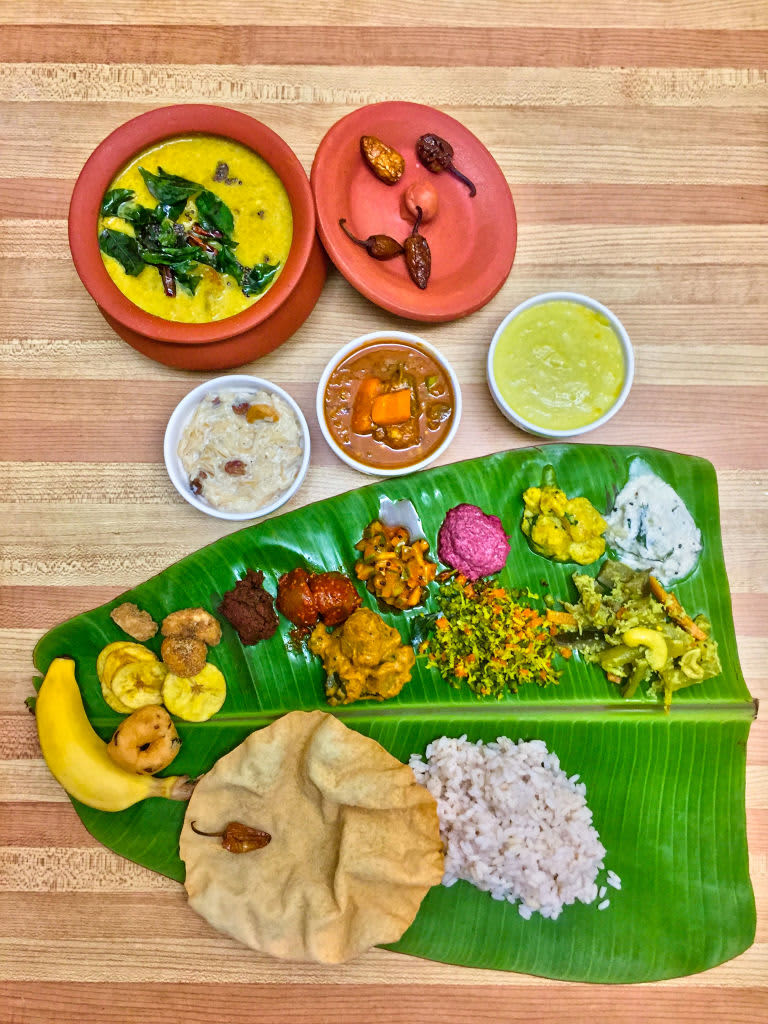 Traditional Sadhya meal served on a banana leaf in Toronto, Ontario, Canada during the Onam Festival on August 28, 2021. Sadhya consists of a variety of traditional vegetarian dishes served on a banana leaf and is common during celebrations and festivals in the Indian state of Kerala. Sadhya means banquet in Malayalam. Onam is a harvest festival and is one of three major annual Hindu celebrations along with Vishu and Thiruvathira observed by Keralites. (Photo by Creative Touch Imaging Ltd./NurPhoto via Getty Images)
