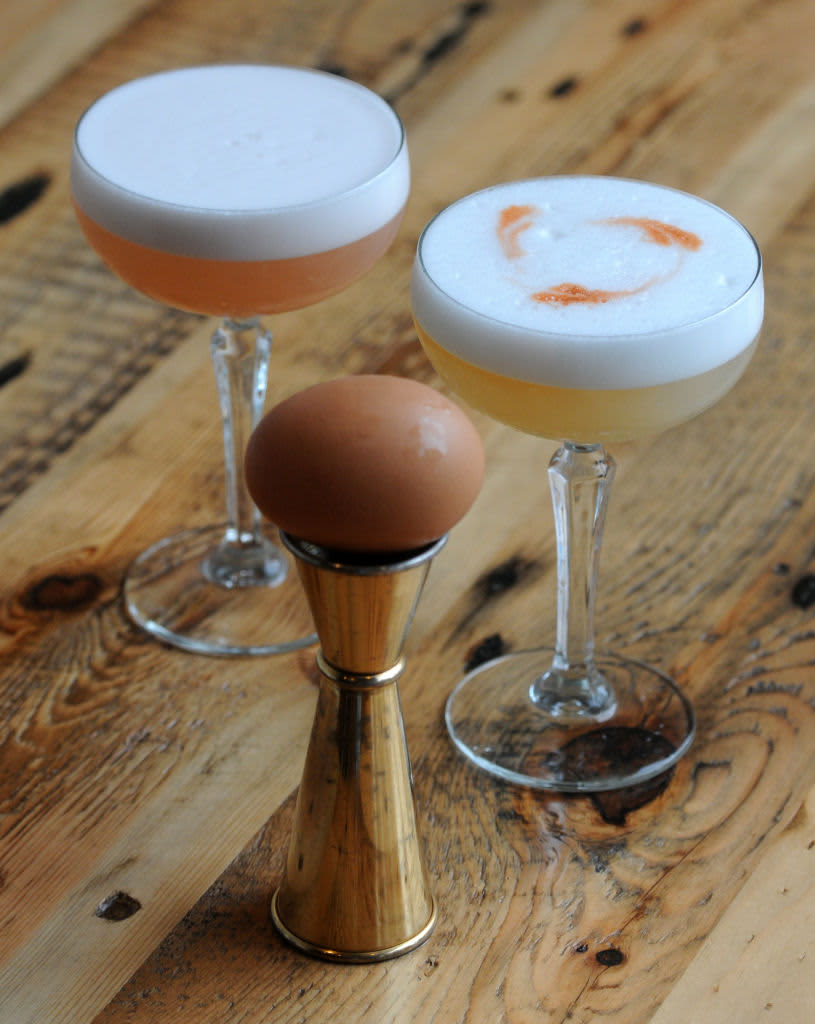 (Boston, MA 04/15/14) Detail shows a Espinosa cocktail  (L) and a Pisco Sour cocktail at Ward 8 on Tuesday, April 15, 2014. The drink has egg whites in it. NOTE: jigger and whole egg (C) Staff photo by Patrick Whittemore. (Photo by Patrick Whittemore/MediaNews Group/Boston Herald via Getty Images)