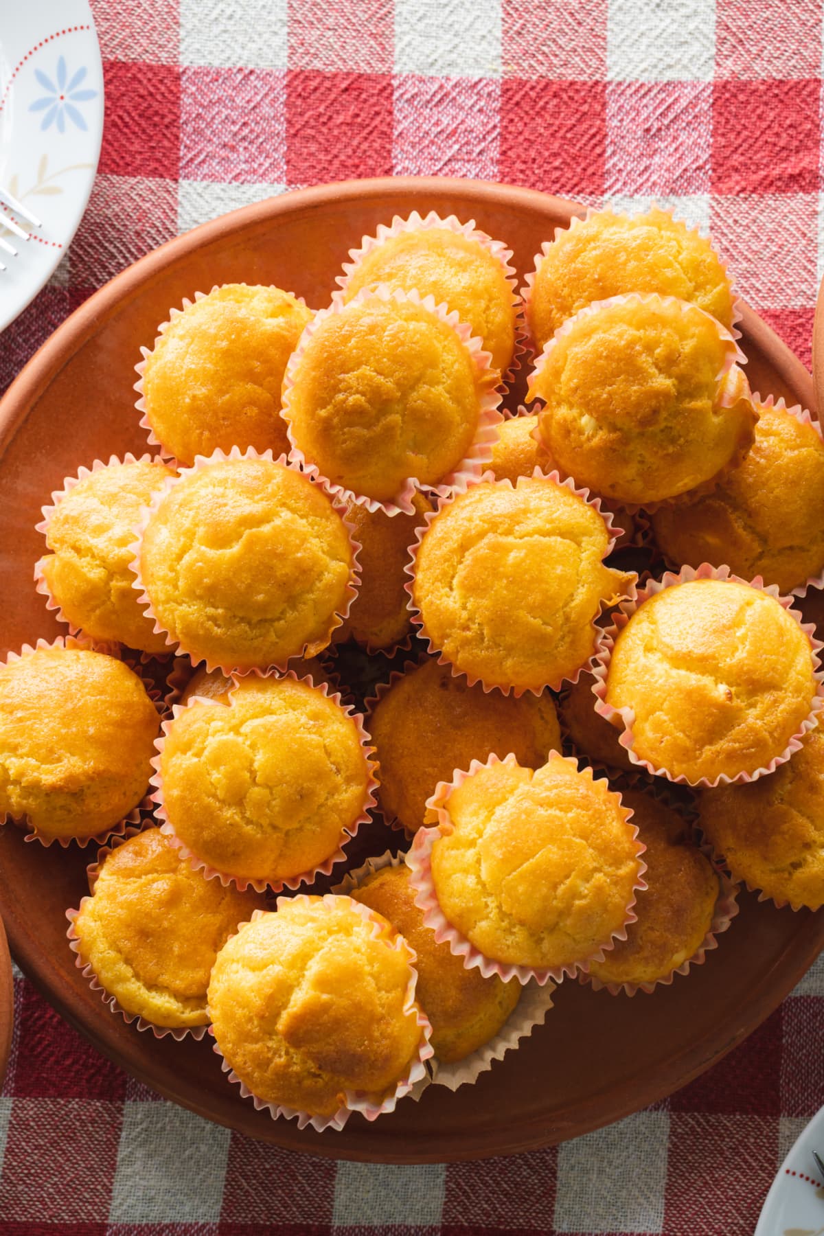 corn pone muffins in a plate on the table fresh baked ready to eat organic homemade food concept vegan or vegetarian traditional meal top view