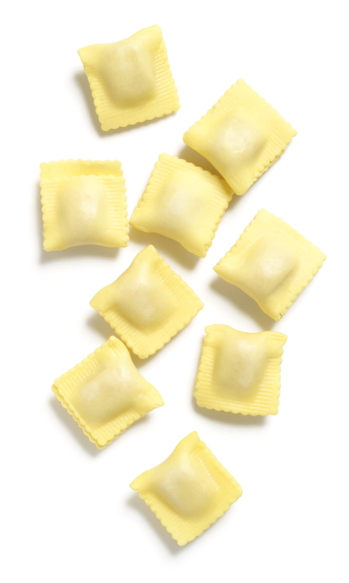 Dry ravioli pasta stuffed with squash isolated on 255 white.