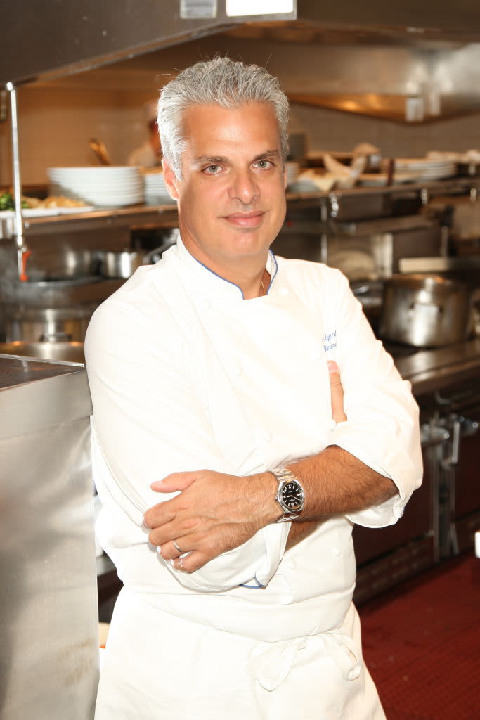Chef Eric Ripert posing in kitchen