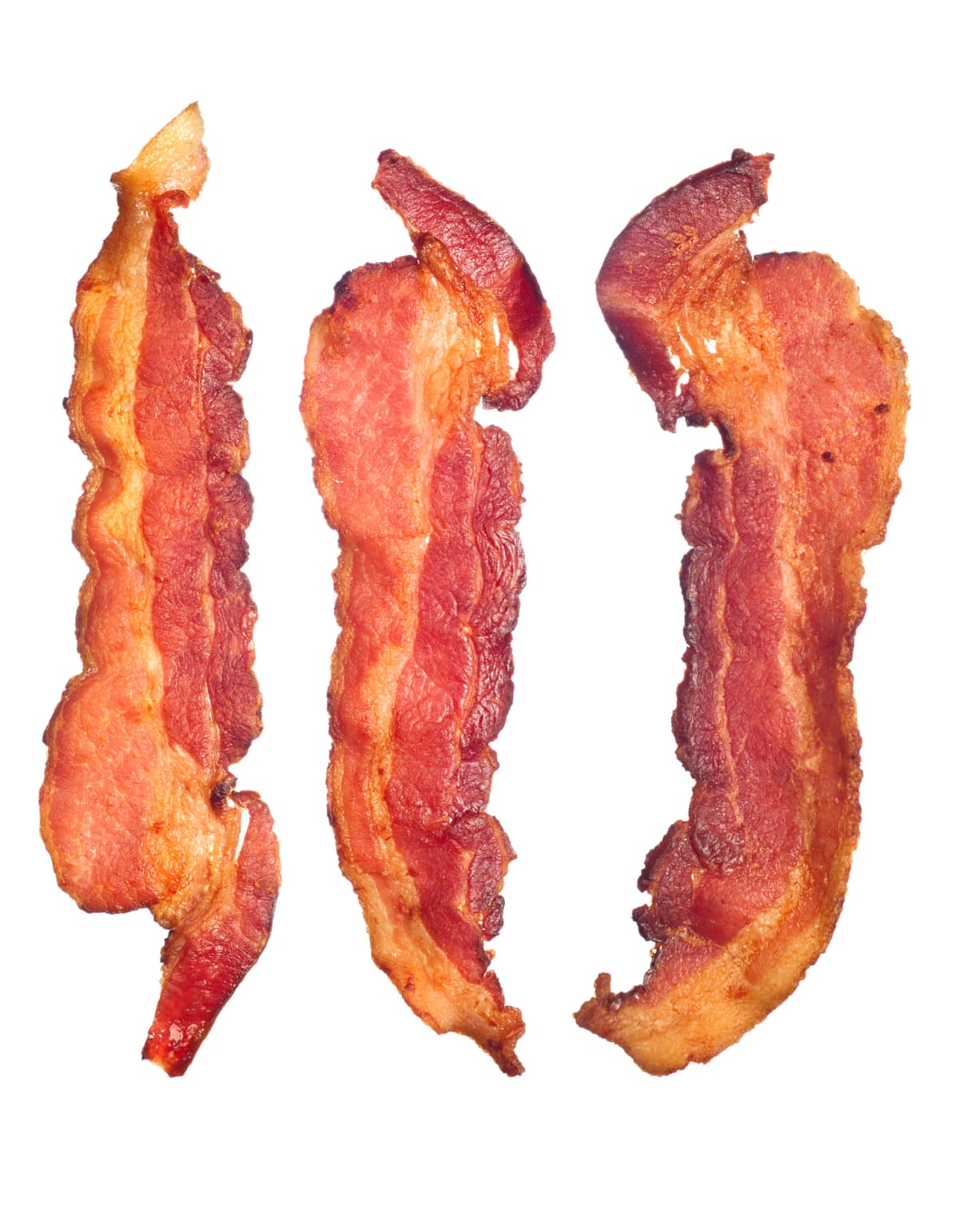 "Three cooked, crispy fried bacon isolated on a white background.  Good for many health and cooking inferences."