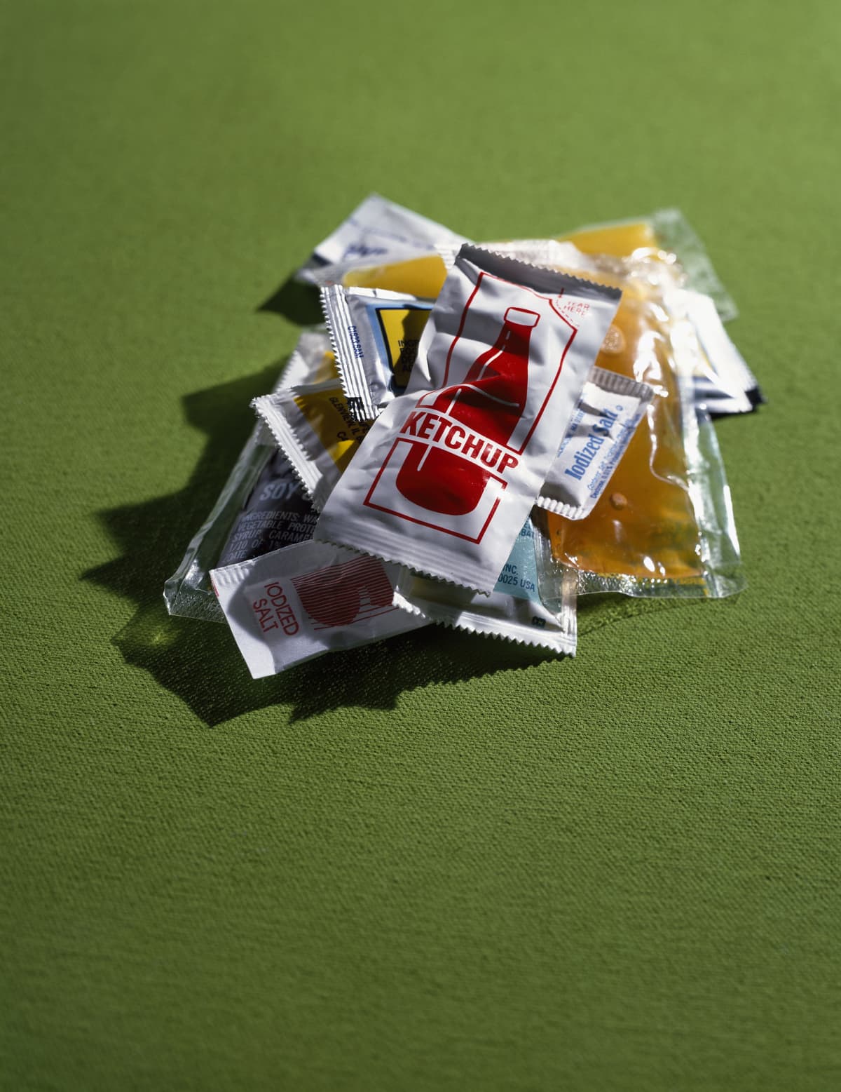 Several plastic packets of condiments